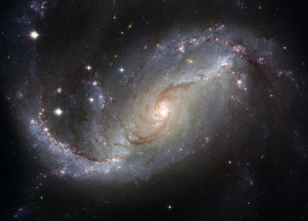 Capture of the NGC 1672 spiral galaxy showcasing its majestic spiral arms and bright core.